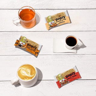 Oat bars with various beverages surrounding them