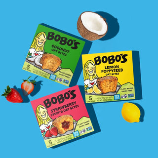 Oat bite on blue background with surrounding Bobo's bars
